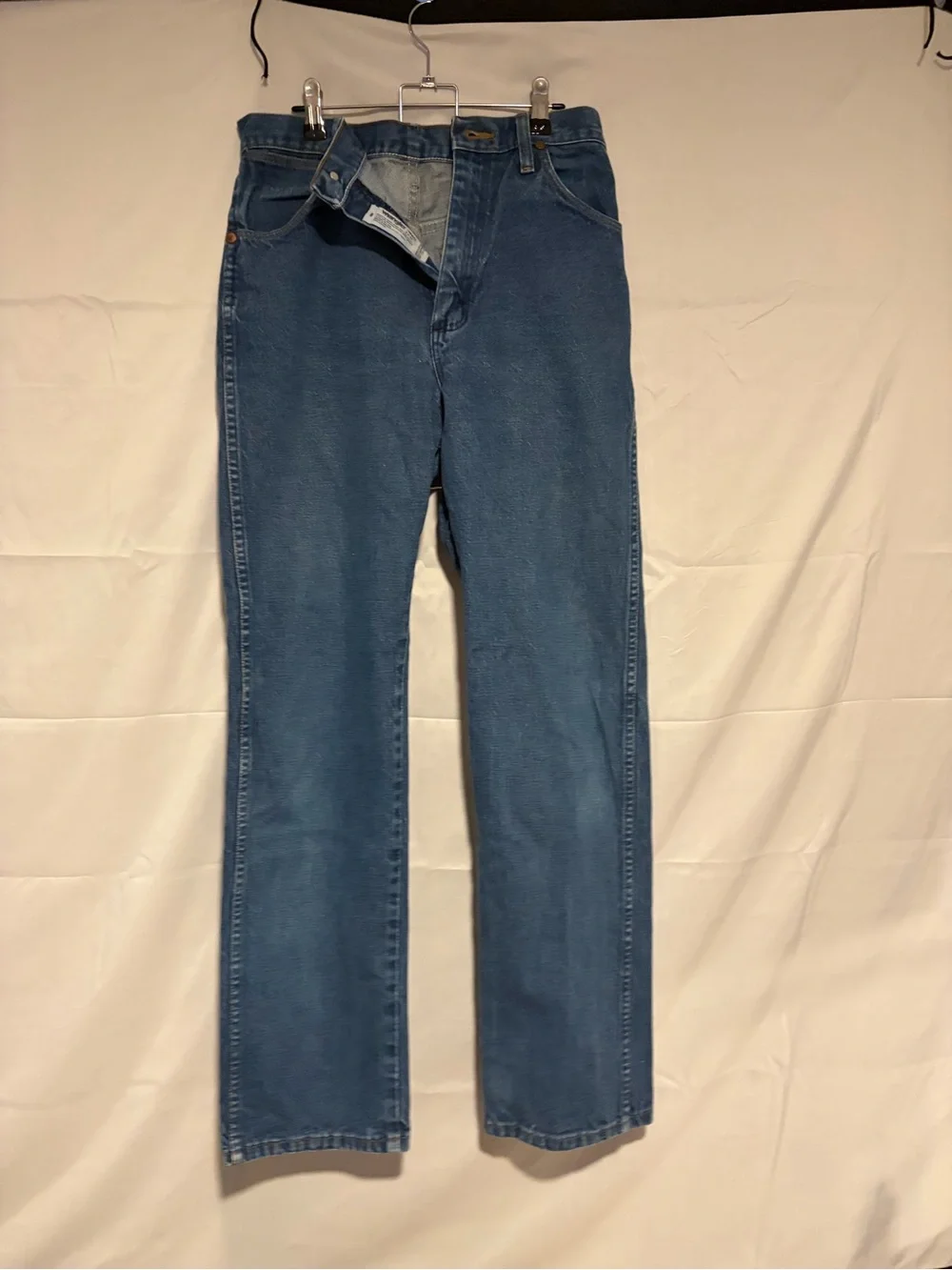 Wrangler Relaxed Fit Denim Jeans in Medium Blue with Orange Stitching